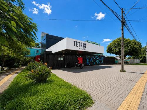 a building with a sign that reads fishing limits at Tetris in Foz do Iguaçu