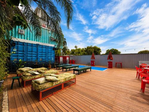 a deck with couches and tables on top of a building at Tetris in Foz do Iguaçu
