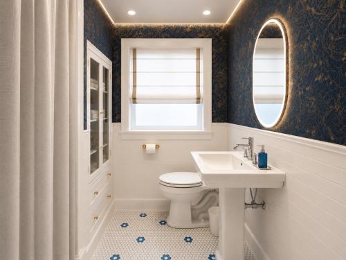 a bathroom with a toilet and a sink and a mirror at Shri Raghav Palace Hotel Ayodhya in Ayodhya