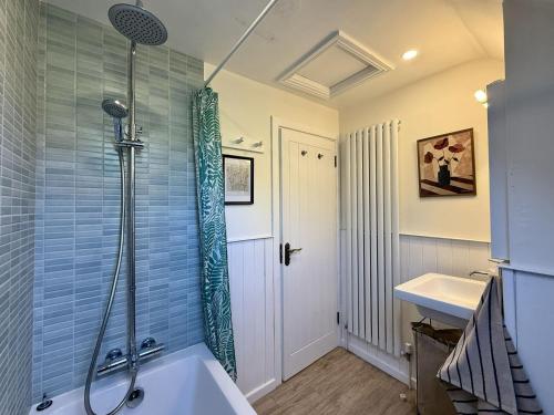 a bathroom with a shower and a sink at Cottage 493 - Clifden in Clifden