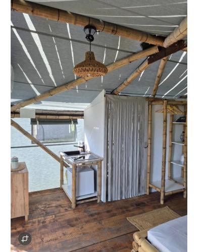 a kitchen in a house under construction with a ceiling at Bamboo glamping in Kotor