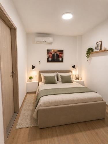 a bedroom with a large bed in a room at Perello Old Town in Split