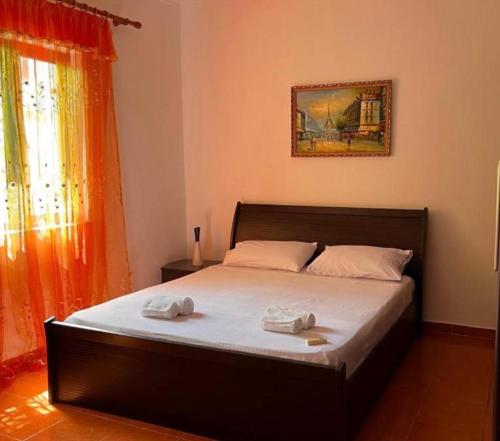 a bedroom with a bed with two towels on it at Berat Private Appartment in Haxhialiu Villa in Berat