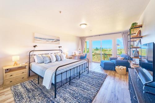 a bedroom with a bed and a living room at Saltwater & Sunsets in Long Beach