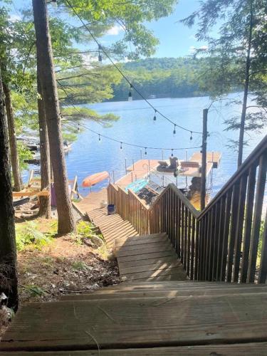 a wooden staircase leading to a dock on a lake at HOLIDAY COVE - LIMIT 8 villa in Naples