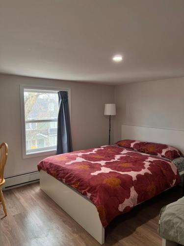 a bedroom with a large bed and a window at Bright Spacious Room-3B in Halifax