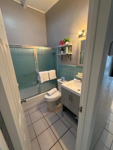 a bathroom with a toilet and a sink at Sea Crest in Sarasota