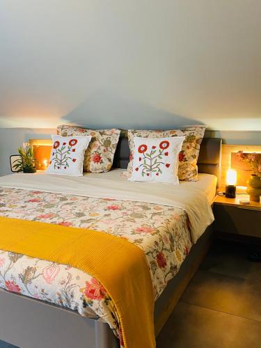 a bedroom with a bed with pillows on it at Nido Vela Appartement in Wesseling