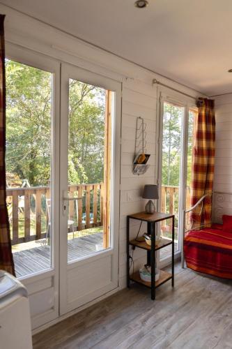 a room with a porch with sliding glass doors at Container Maritime Montagne Noire in Fontiers-Cabardès