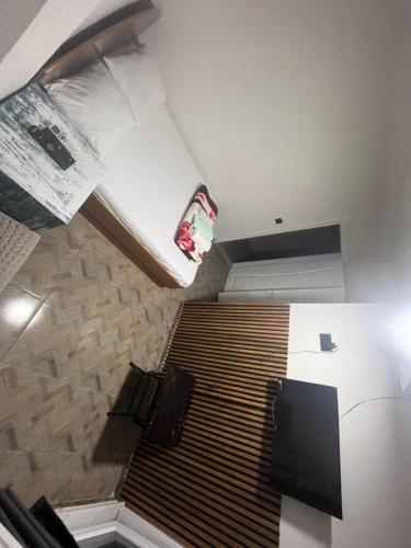 a room with a bunk bed and a staircase with appelin at AirPort geust house in Arnavutköy