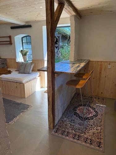a kitchen with a counter and a chair in a room at Vangeled Gaard B&B - Apartments in Holtug