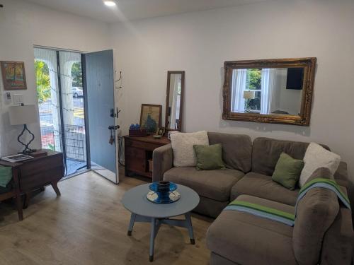 a living room with a couch and a table at Casa Dorado - Bright, Sunny 2 Bedroom 1 Bath House - Fenced Yard, Private Patio in Santa Barbara