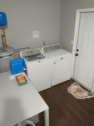 a laundry room with a washer and dryer at Whole House All Yours! in Cocoa