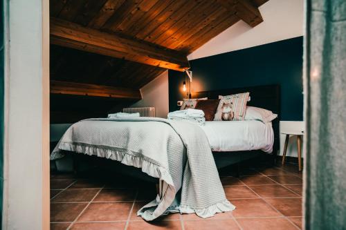 a bedroom with a bed with a blanket on it at Bixio 7 Boutique stay in Imola