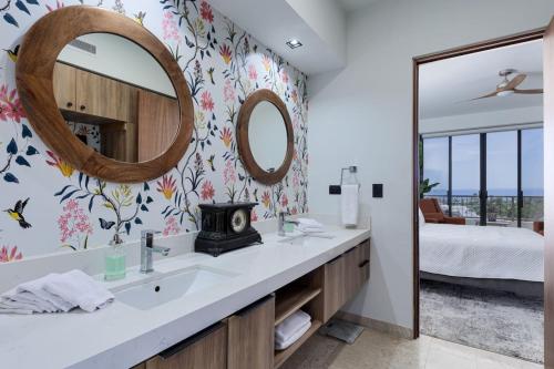 a bathroom with a sink and a mirror at Modern 4BR Villa with Rooftop & Pickleball in Los Barriles