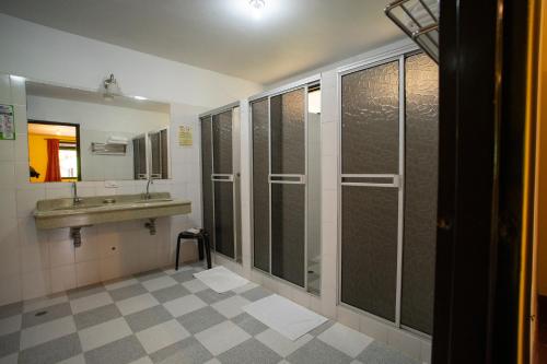a bathroom with a sink and a shower at Hotel Guaitipan Ancestral in San Agustín