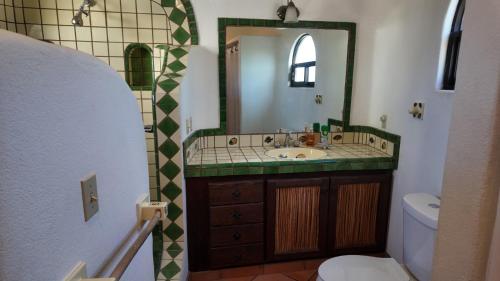 a bathroom with a sink and a mirror at Ocean view casita in Palo Blanco in Los Barriles