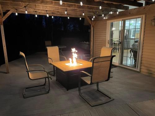 a wooden table and chairs on a patio at Lake Melissa Cabin on the Commons in Detroit Lakes