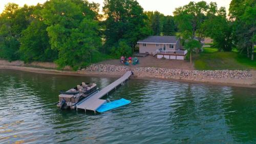 a boat on a dock in the water at Amazing Grace Etta Shores in Henning