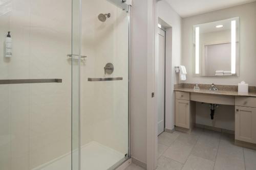 a bathroom with a shower and a sink at TownePlace Suites by Marriott Reno in Reno