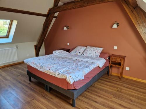 a bedroom with a bed in a attic at Maison Le Thuau in Sargé-lès-Le Mans