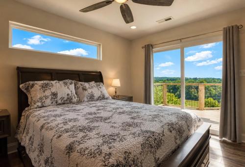 a bedroom with a bed and a large window at Broadview, River, Golf Course, Games, free Attraction Tickets, WIFI!!! in Kodak