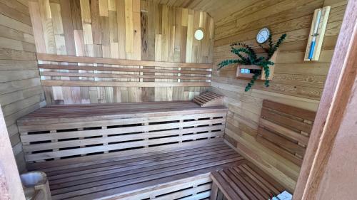 a sauna with a wooden bench in a room at Elkwood Manor Bed & Breakfast in Pagosa Springs
