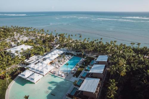 an aerial view of a resort with a pool and the beach at Catalonia Royal Bavaro - All Inclusive - Adults Only in Punta Cana