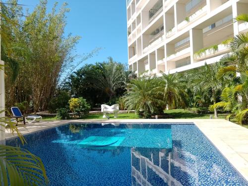 a swimming pool in front of a building at Mesón de la Luna Hotel & Spa in Mérida
