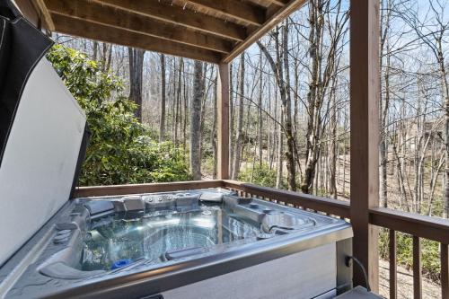 a hot tub on the balcony of a house at Eagles View in Boone