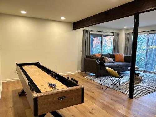 a living room with a pool table in it at A-Frame on Balsam in Valle Crucis