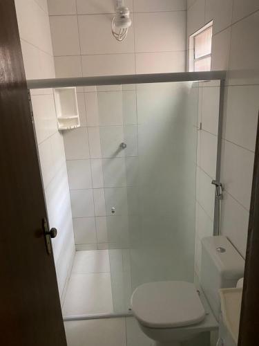 a bathroom with a shower and a toilet at Casaavatar12 in Piranhas