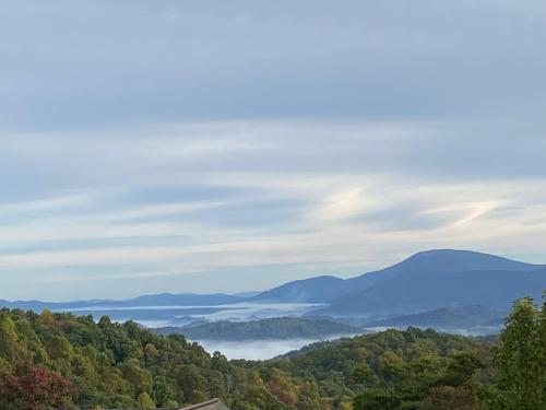 a view of a valley with trees and mountains at Mountain View Manor in Banner Elk