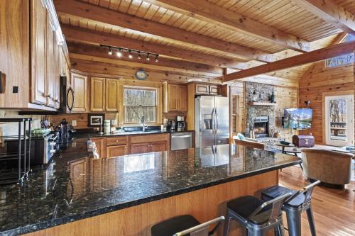 a large kitchen with wooden cabinets and a counter top at A-Typical in Boone