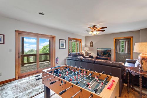 a living room with a foosball table at Blue Mist in Blowing Rock