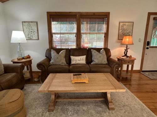 a living room with a couch and a coffee table at Fehrway to Heaven in Blowing Rock