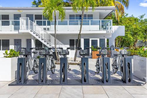 a row of bikes parked in front of a building at King Suite at Ocean Blvd in Fort Lauderdale