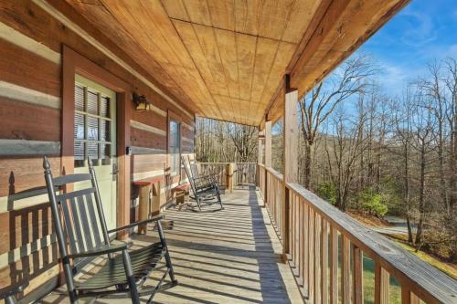 a porch of a home with rocking chairs on it at Trailhead Cabin in Boone