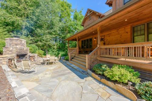 a porch of a house with chairs and a patio at Valle Crucis Overlook in Banner Elk