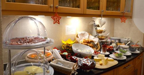 a kitchen counter with a bunch of food on it at Pension Christine in Gaschurn