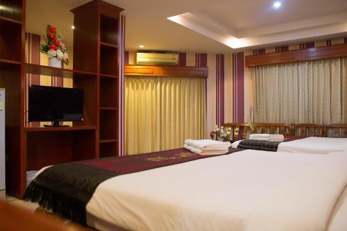Krevet ili kreveti u jedinici u okviru objekta Natural Samui Hotel