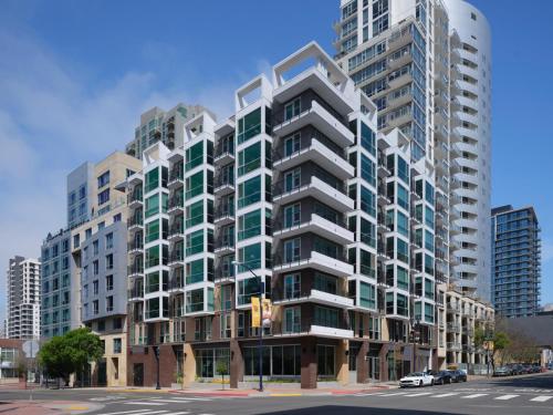 a tall apartment building on a city street at The Margot Hotel San Diego Gaslamp Quarter, Outset by Hilton in San Diego
