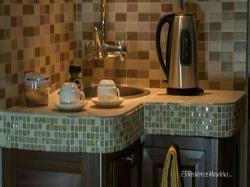Una cocina o cocineta en Easy Stay Residence