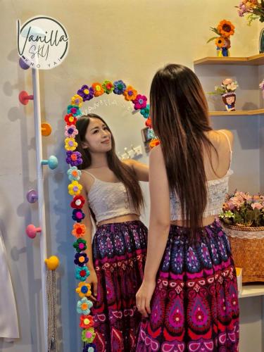 a woman is looking at herself in a mirror at Vanilla Sky @Khao Yai in Ban Bung Toei