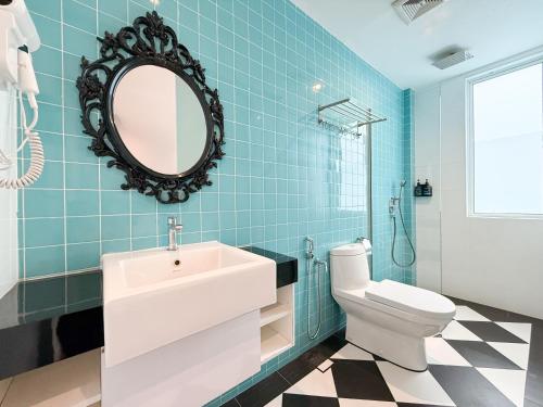 a bathroom with a sink and a toilet and a mirror at Havona Boutique Hotel - Mount Austin - Self Check-in in Johor Bahru