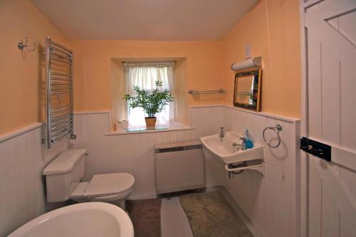 a bathroom with a toilet and a sink at 4 Bed in Renvyle oc-i258 in Salrock