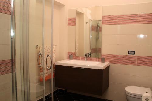 a bathroom with a sink and a shower and a toilet at Affittacamere Bellavista in San Marco dei Cavoti