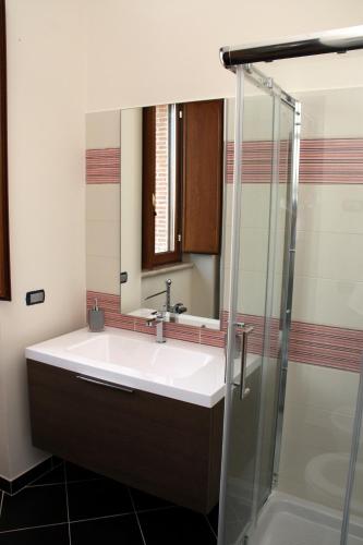 a bathroom with a sink and a shower at Affittacamere Bellavista in San Marco dei Cavoti