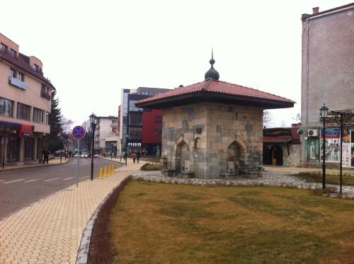 a small building with a roof on a street at Euphoria Club Hotel in Borovets