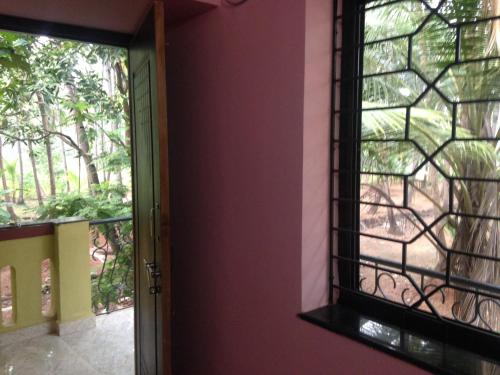 a door with a window in a room at All Seasons Guest House in Vasco Da Gama